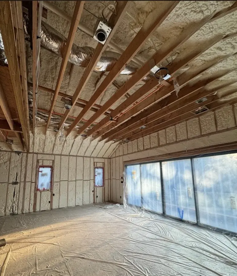 Interior walls and ceiling insulated with spray foam during new construction in Peppermill Village